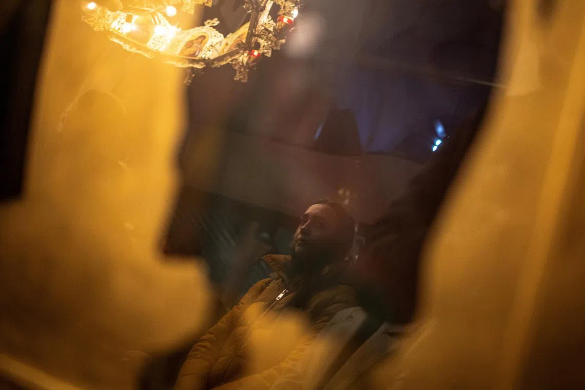 A woman attending a prayer service following a fire at the Pulse nightclub that resulted in dozens of deaths, in the town of Kocani, North Macedonia, March 19, 2025. 