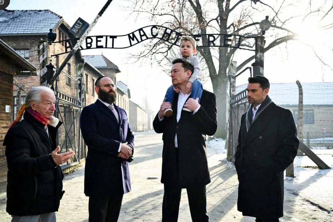 Elon Musk takes part in a private visit to Auschwitz-Birkenau with European Jewish Association (EJA) Chairman Rabbi Menachem Margolin, Ben Shapiro and Holocaust survivor Gidon Lev in Oswiecim, Poland January 22, 2024.  European Jewish Association/Yoav Dudkevitch/Handout via REUTERS    THIS IMAGE HAS BEEN SUPPLIED BY A THIRD PARTY MANDATORY CREDIT NO RESALES. NO ARCHIVES.     TPX IMAGES OF THE DAY     