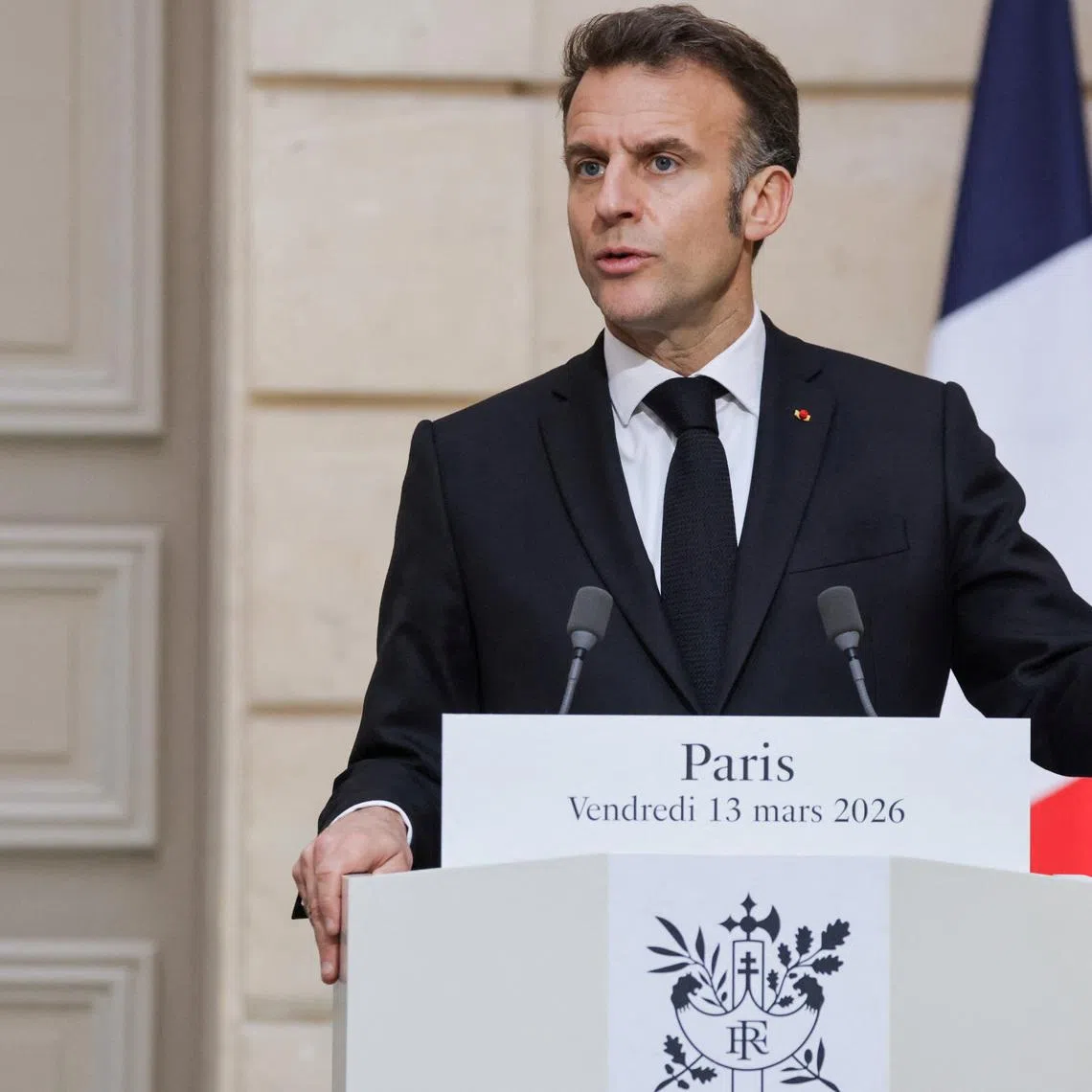 FILE PHOTO: France's President Emmanuel Macron delivers a speech during a joint press conference with Ukraine's President Volodymyr Zelensky, in Paris, March 13, 2026. LUDOVIC MARIN/Pool via REUTERS/File Photo