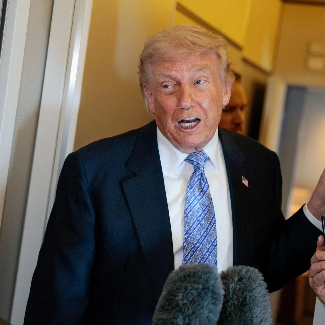 FILE PHOTO: U.S. President Donald Trump speaks to the press aboard Air Force One enroute to the U.S.  following his official visit with President Xi Jinping in China, May 15, 2026. REUTERS/Evan Vucci/File Photo