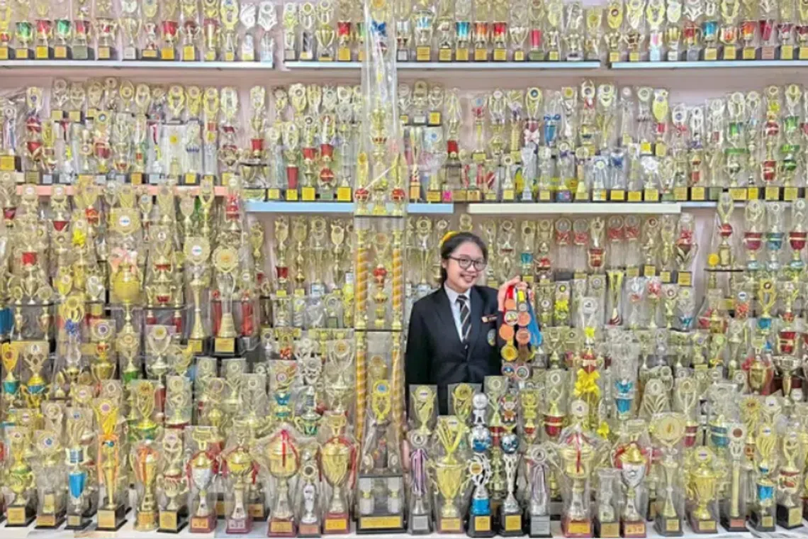 Ms Yap Wen Min, 19, has won over 1,000 trophies in Mathematics, Science, debating and public speaking competitions,