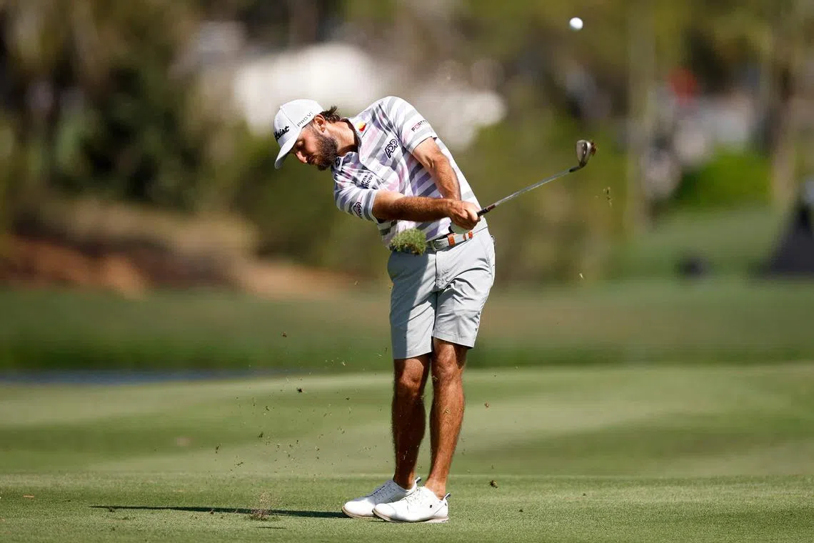 Max Homa plays an approach shot on the sixth hole during a practice round prior to the Players Championship.