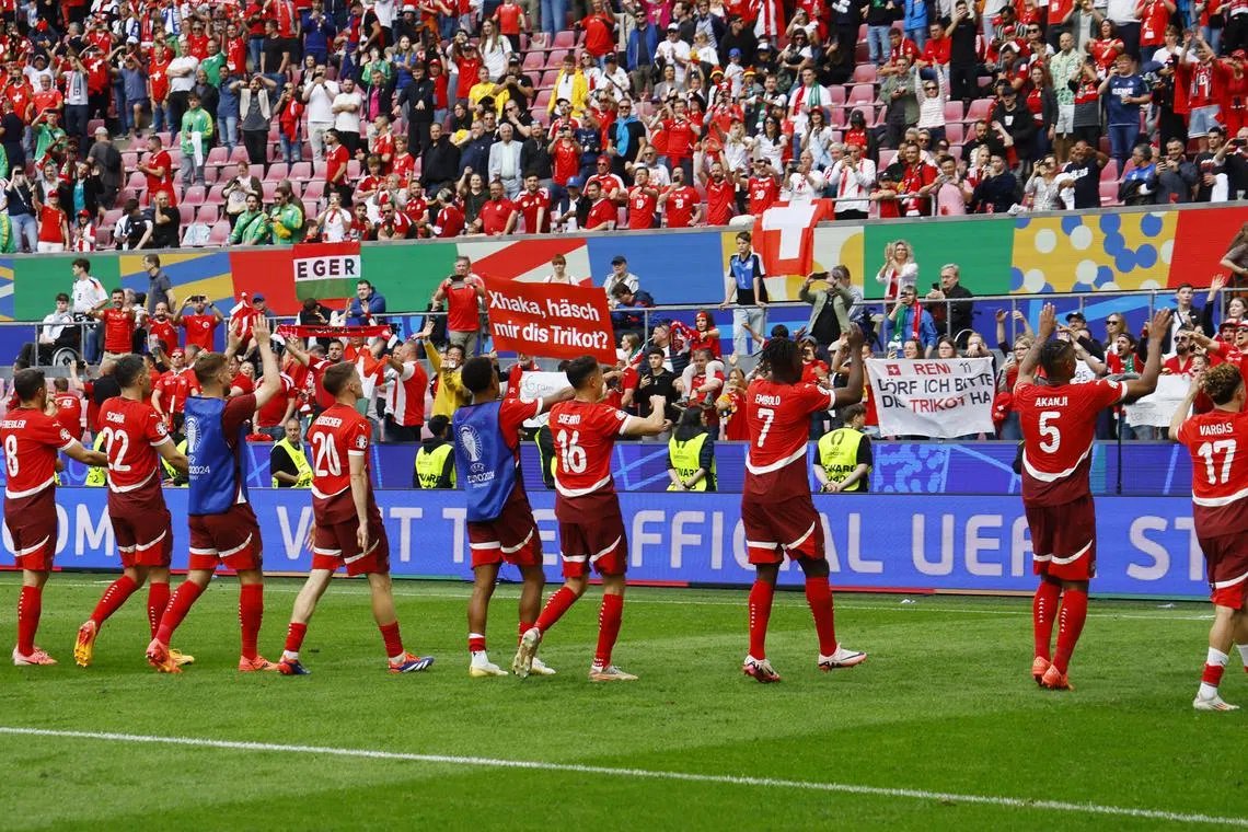 FILE PHOTO: Soccer Football - Euro 2024 - Group A - Hungary v Switzerland - Cologne Stadium, Cologne, Germany - June 15, 2024 Switzerland players celebrate after the match REUTERS/Wolfgang Rattay/File Photo
