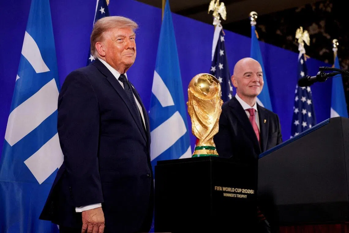 US President Donald Trump (left) and FIFA President Gianni Infantino attend a FIFA reception at Trump Tower on July 17.