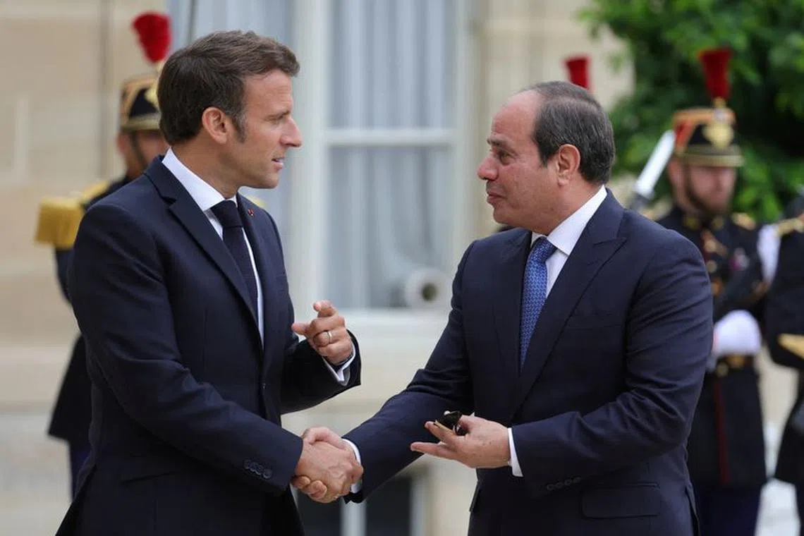French President Emmanuel Macron welcomes Egyptian President Abdel Fattah al-Sisi at the Elysee Palace in Paris, France, July 22, 2022. REUTERS/Pascal Rossignol/File Photo