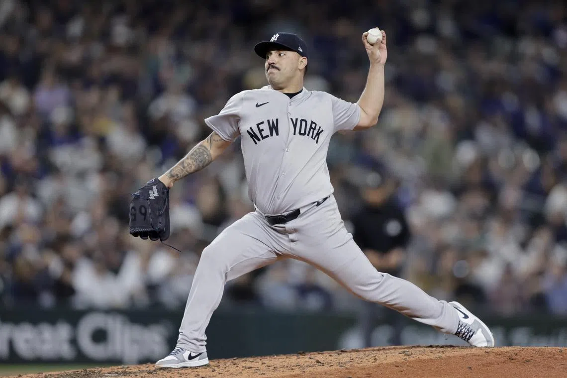 FILE PHOTO: Sep 18, 2024; Seattle, Washington, USA; New York Yankees starting pitcher Nestor Cortes (65) throws against the Seattle Mariners during the fifth inning at T-Mobile Park. Mandatory Credit: John Froschauer-Imagn Images/File Photo