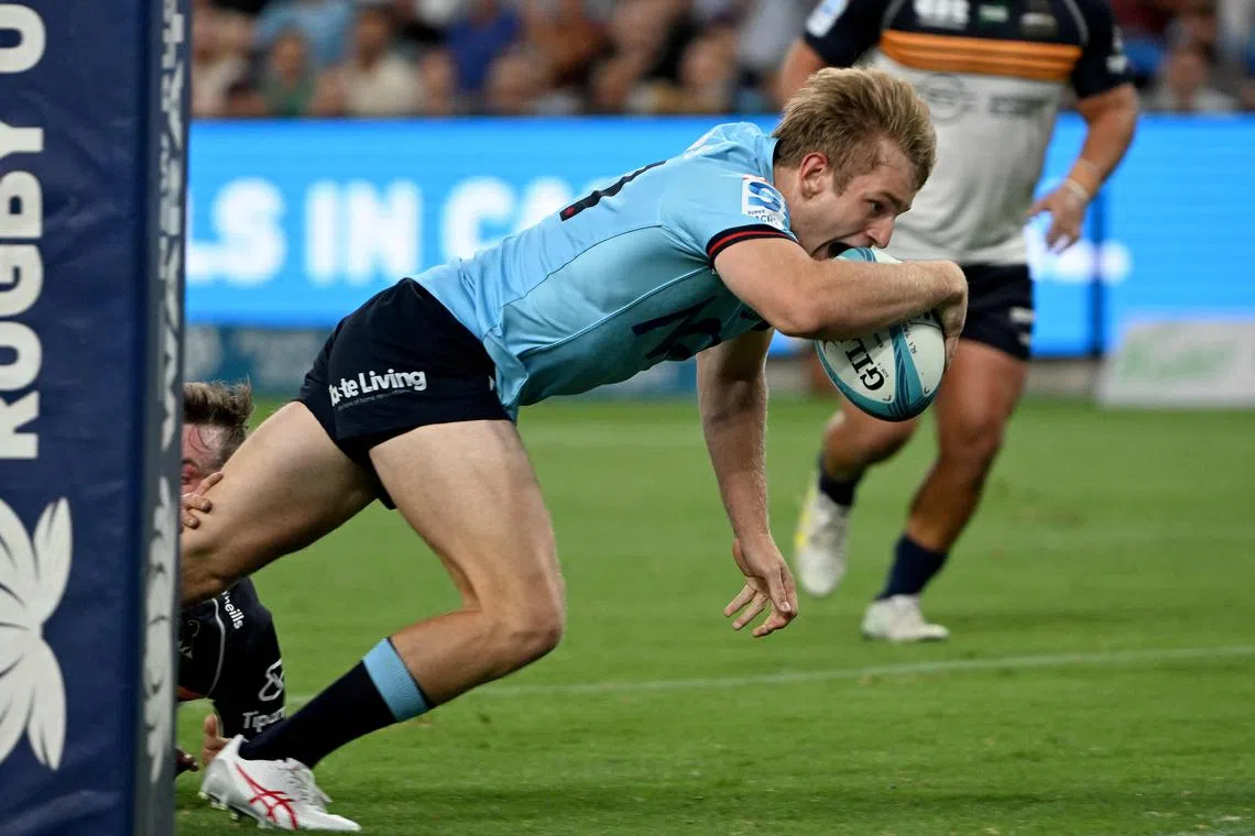 Waratahs' Max Jorgensen scoring a try during the Super Rugby match between the NSW Waratahs and ACT Brumbies at Allianz Stadium in Sydney on Feb 24, 2023. 
