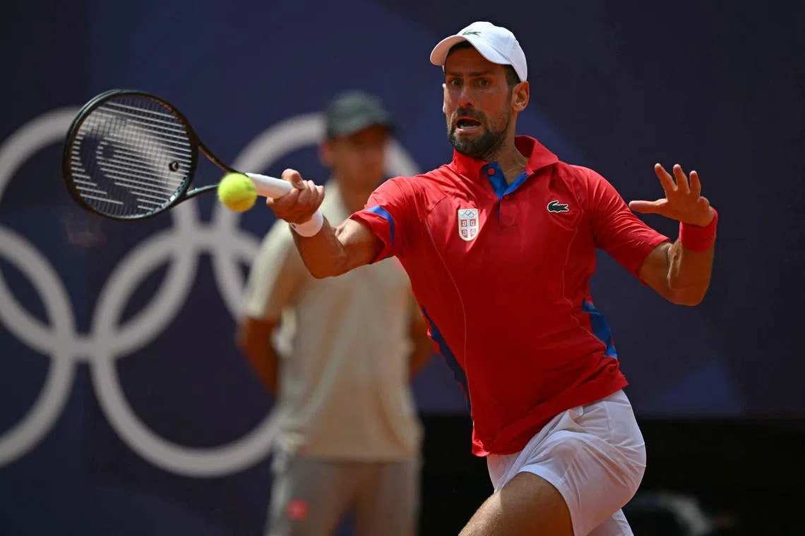 Serbia's Novak Djokovic returns against Germany's Dominik Koepfer during their Paris Olympics third-round match at Roland Garros.