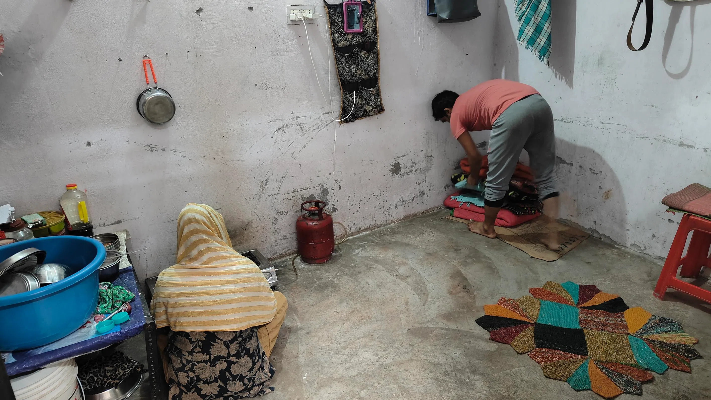Mr Vijendra Kumar (right) and his wife, Ms Nisha, at their one-room dwelling in Noida.