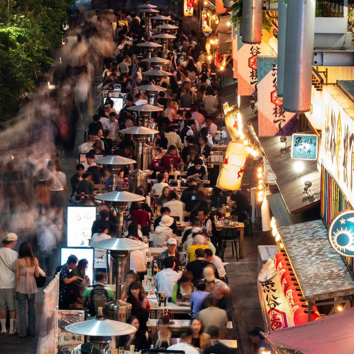 Diners at Tokyo's Shibuya district on May 16. Japan’s crackdown on visa overstayers and illegal foreign workers comes at a time when it is taking in more foreign workers owing to labour shortages.