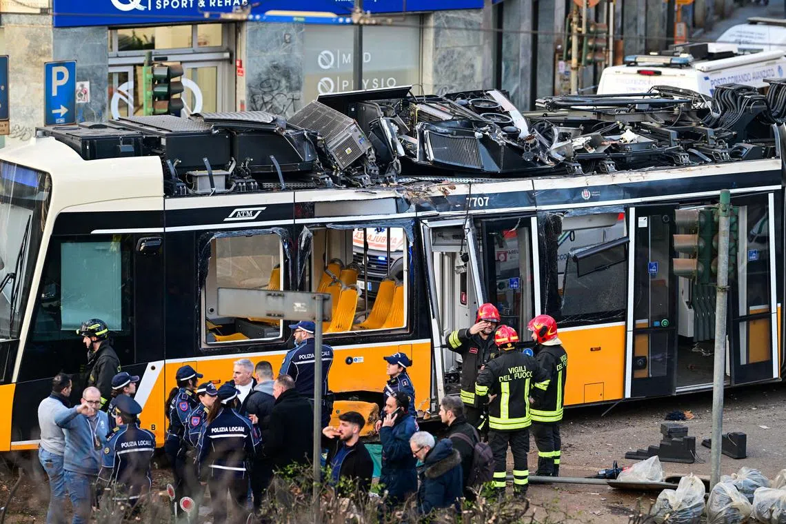 Emergency services work at the scene following a deadly tram derailment in Milan, Italy, February 27, 2026. REUTERS/Daniele Mascolo