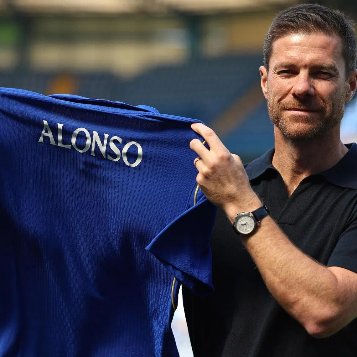 Xabi Alonso, manager of Chelsea Football Club, posing with a jersey after a press conference at Stamford Bridge in London, Britain, 13 July 2026.  EPA/NEIL HALL