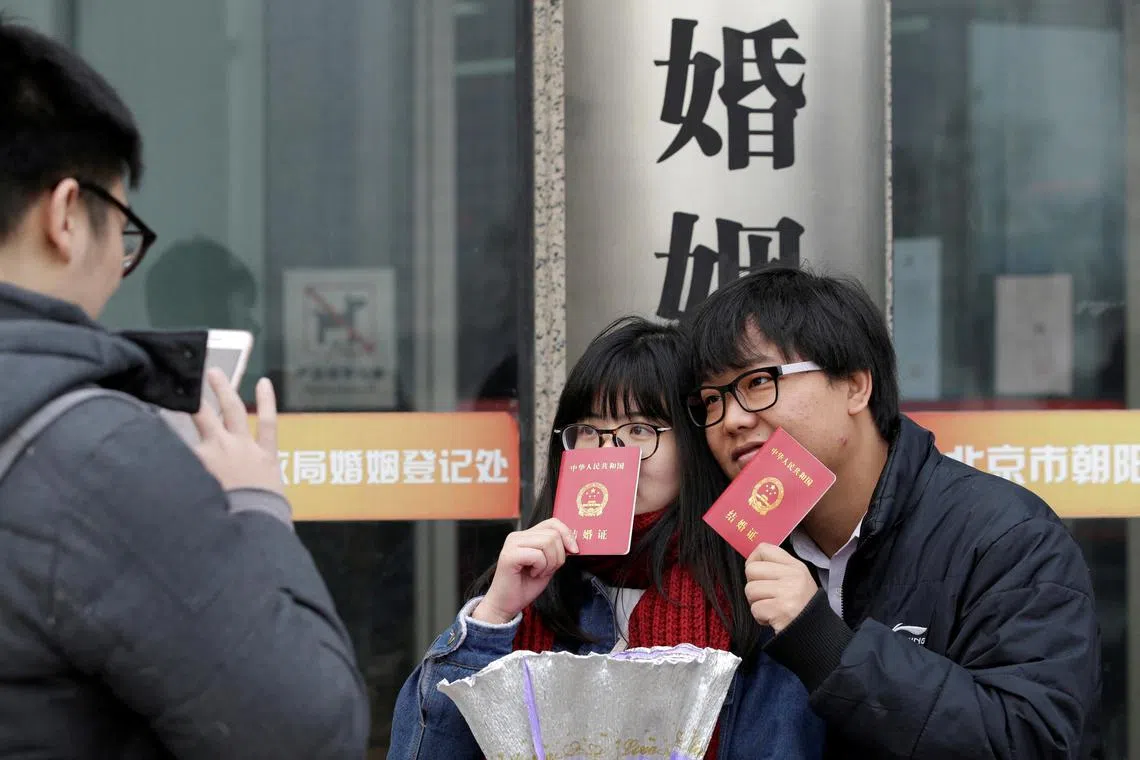 A newly married couple in Beijing.  China has been trying an array of measures to get more of its people to have kids.