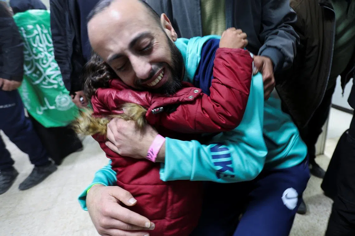 FILE PHOTO: Tarek Rabie Safi, a freed Palestinian prisoner, hugs his daughter after being released by Israel as part of a hostages-prisoners swap and a ceasefire deal in Gaza between Hamas and Israel, in Khan Younis, in the southern Gaza Strip, February 15, 2025. REUTERS/Ramadan Abed/File Photo