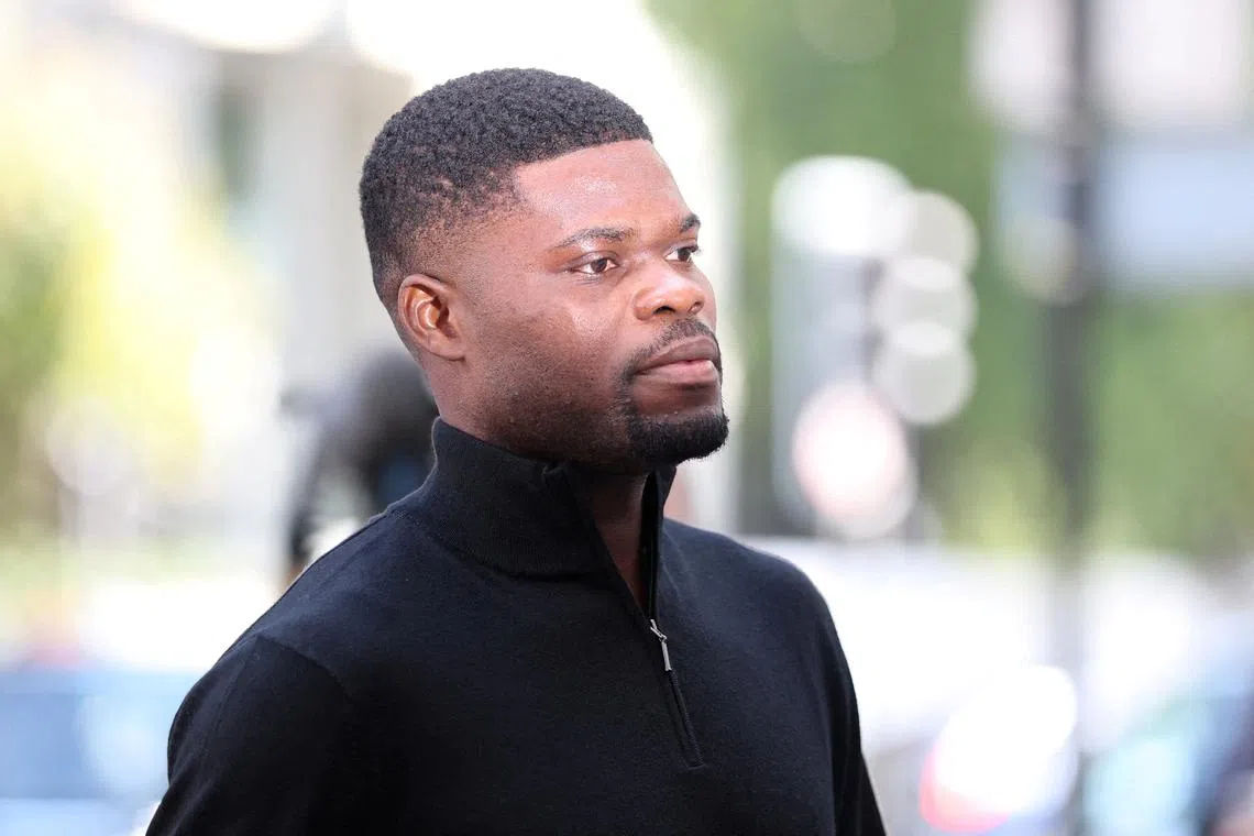 Former Arsenal player Thomas Partey, who has been charged with five counts of rape and one count of sexual assault, walks outside Westminster Magistrates' Court, in London, Britain, August 5, 2025. REUTERS/Hannah McKay