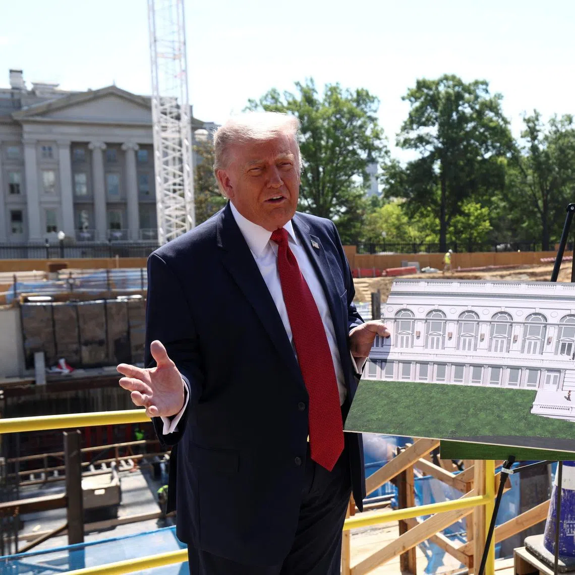 US President Donald Trump showing images of the concept at the site of ongoing construction of the planned White House ballroom on May 19 in Washington DC.