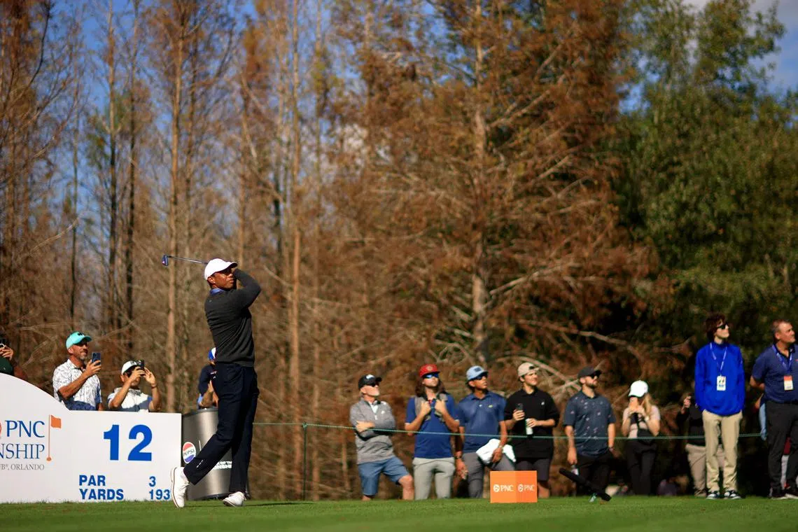 Tiger Woods plays in the pro-am ahead of the PNC Championship at Ritz-Carlton Golf Club.