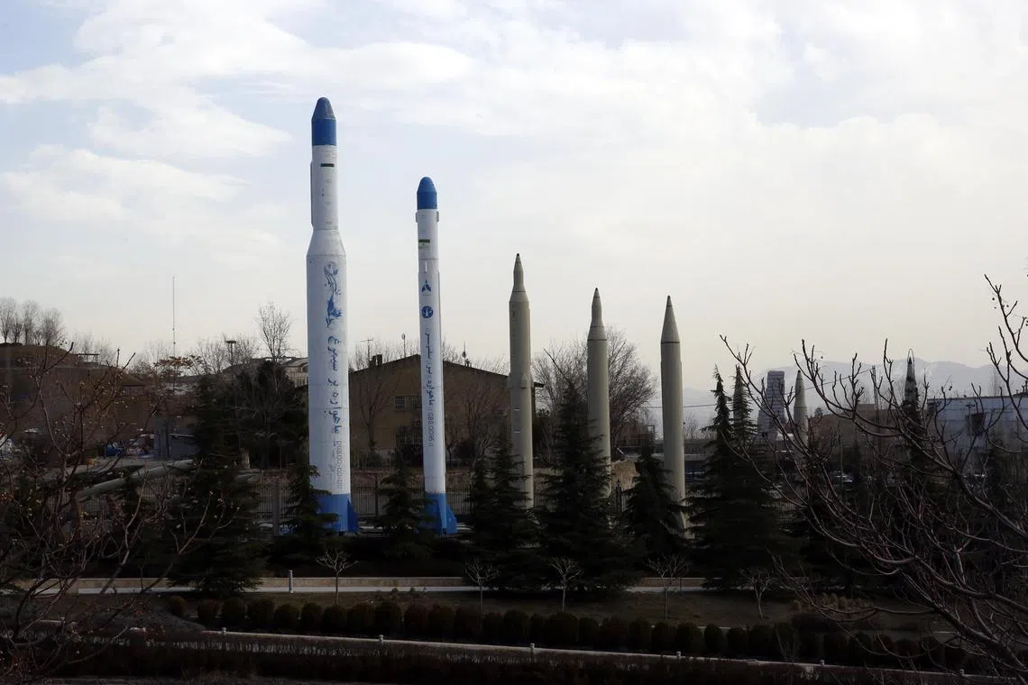 Different kinds of long-range Iranian missiles are displayed at a defence exhibition in Teheran.