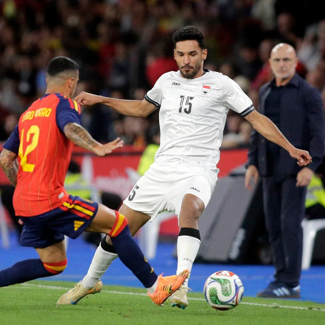 Soccer Football - International Friendly - Spain v Iraq - Riazor stadium, A Coruna, Spain - June 4, 2026 Iraq's Ahmed Yahya Mhmood Al Hajjaj in action with Spain's Pedro Porro REUTERS/Miguel Vidal