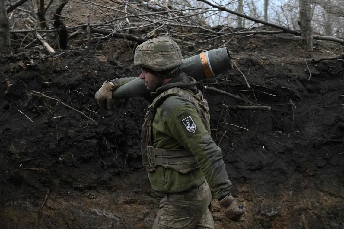 A Ukrainian artilleryman preparing to fire a French-made Caesar self-propelled howitzer towards Russian positions in Ukraine's Donetsk region, on Jan 6.