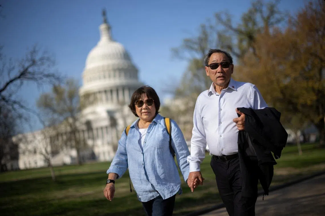 Norman Wong, the great-grandson of Wong Kim Ark, and his wife Maureen walk by the U.S. Capitol building as they arrive at demonstration outside the U.S. Supreme Court building on the day the court hears oral arguments on the legality of the Trump administration's effort to limit birthright citizenship for the children of immigrants, in Washington, D.C., U.S., April 1, 2026. In 1898, Wong Kim Ark challenged the U.S. government after being denied re-entry to the country following a trip to his parents' homeland. Though he was born in the United States, authorities claimed he was not a citizen. The Supreme Court ruled in his favor, firmly establishing that the 14th Amendment guarantees birthright citizenship. REUTERS/Carlos Barria