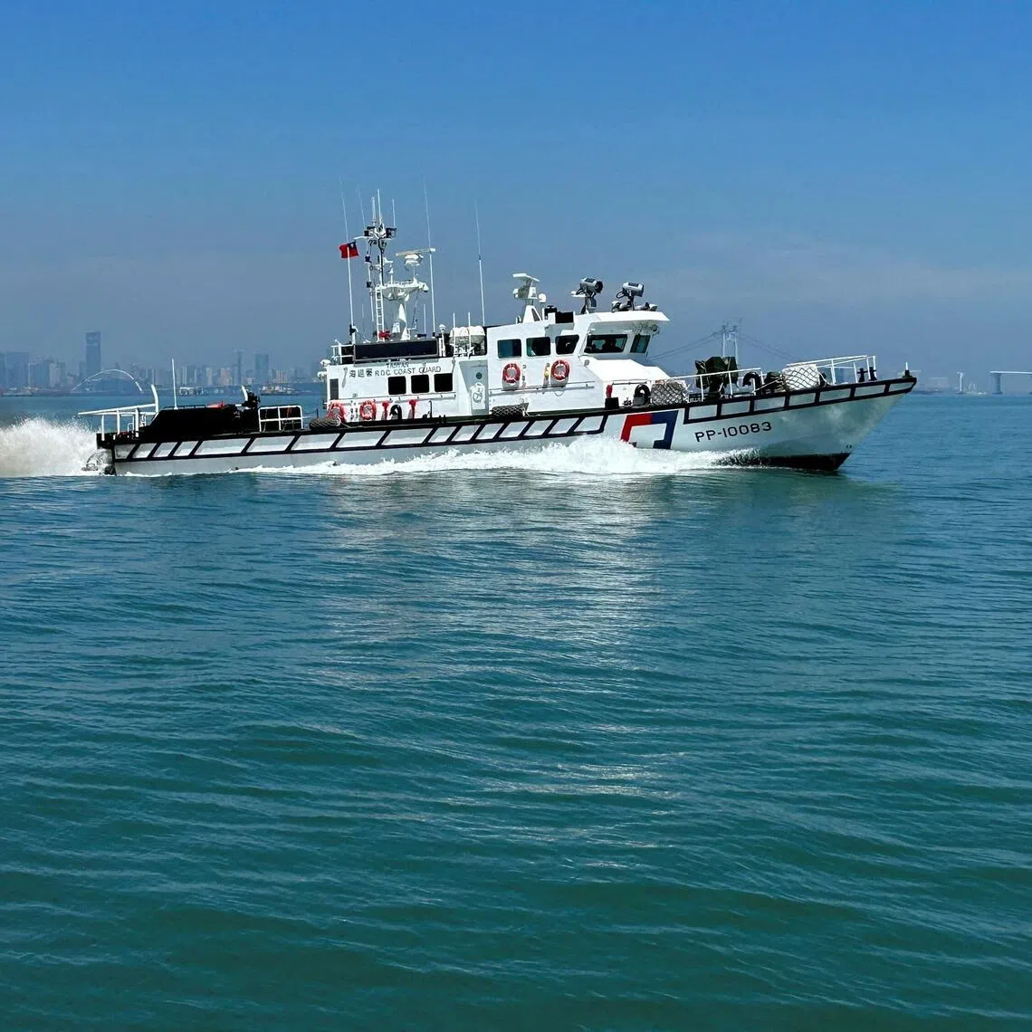 FILE PHOTO: A Taiwan Coast Guard ship patrols around Taiwan's Kinmen islands with the Chinese coast visible in the background, July 9, 2026. REUTERS/Ben Blanchard/File Photo