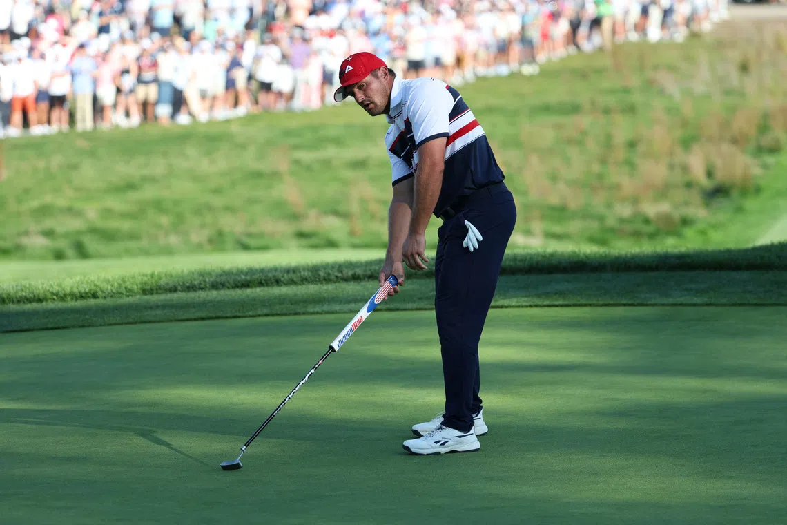 Golf - The 2025 Ryder Cup - Bethpage Black Golf Course, Farmingdale, New York, United States - September 28, 2025 Team USA's Bryson DeChambeau reacts to a missed putt on the 17th hole during the singles REUTERS/Brendan Mcdermid