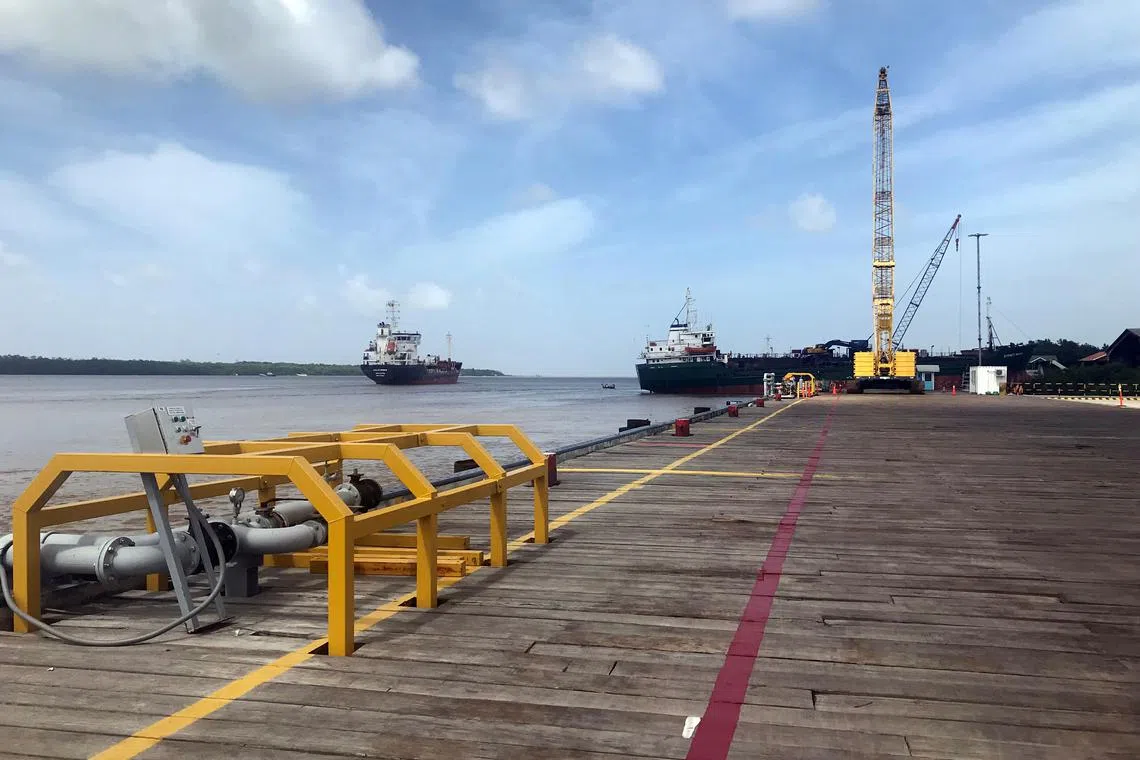 FILE PHOTO: Vessels carrying supplies for an offshore oil platform are seen, south of Georgetown, Guyana, January 23, 2020. REUTERS/Luc Cohen/File Photo