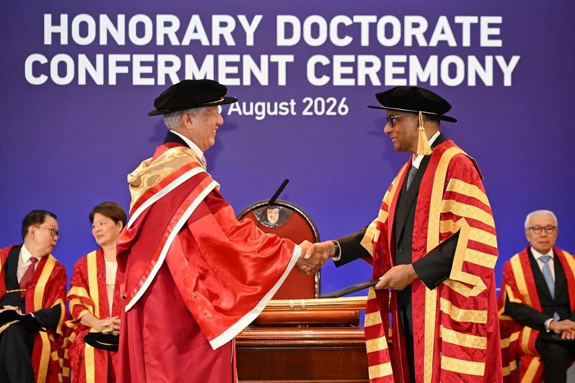 Teo Chee Hean (left) received the honorary degree of Doctor of Letters from President Tharman Shanmugaratnam (right), who is NTU chancellor, during a ceremony at NTU on Aug 26.