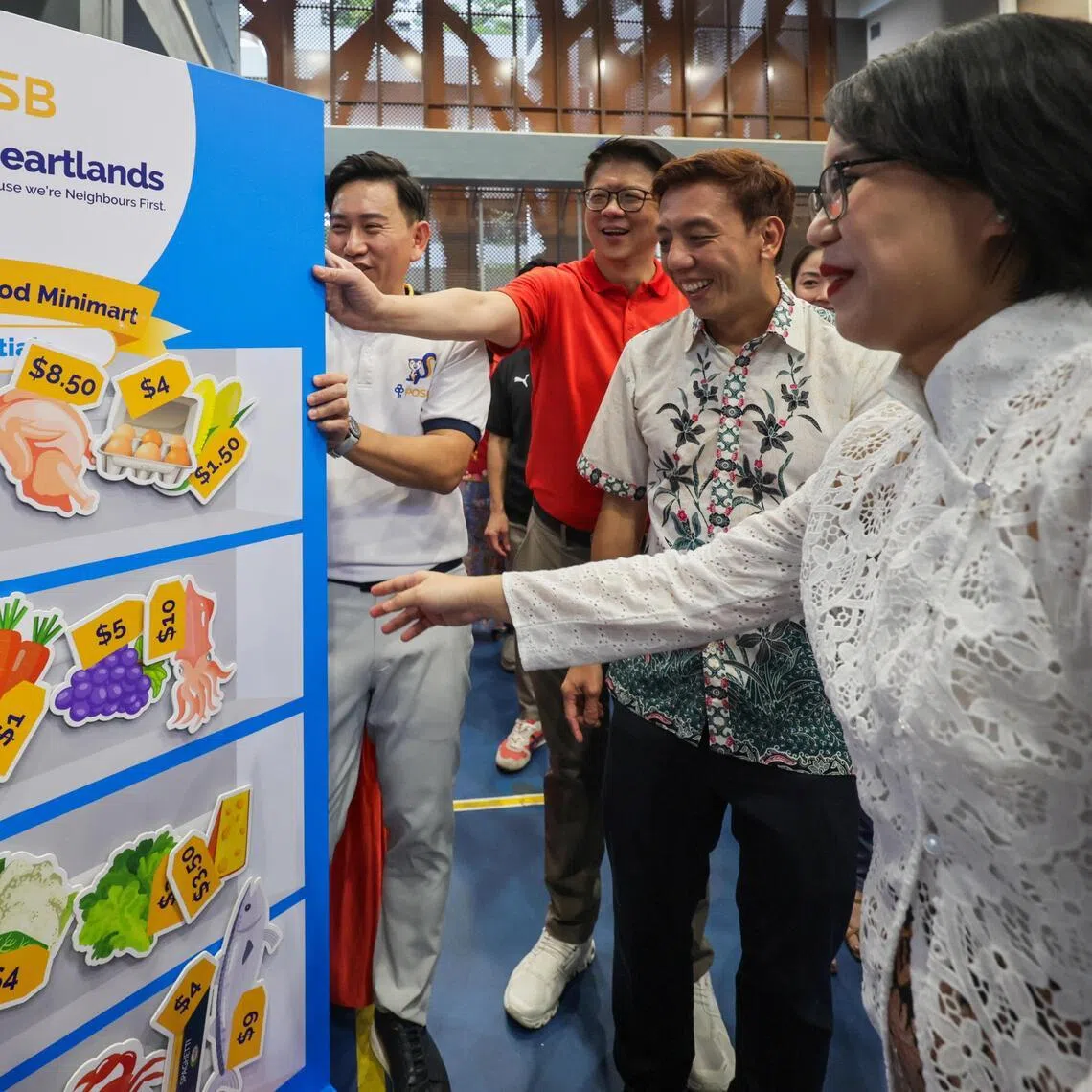 (Second from left): Mr Lim?Him Chuan,?Singapore Country Head, DBS Bank; Mr Jeffrey Siow,?Acting Minister for Transport and Senior Minister for Finance, MP for CCK GRC (Brickland-Tengah); and Dr Choo?Pei Ling, MP for CCK GRC (Tengah); participating at the DBS / POSB activities booth during the launch of DBS/POSB's SGD 10 million cost of living package in Tengah Community Club on Apr 25, 2026.