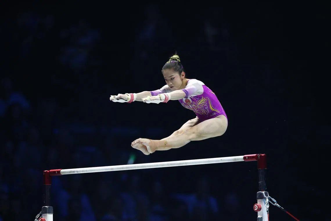 Xiaoyuan Wei of China performs on the parallel bars in the women's Apparatus Finals in Britain on Nov 5, 2022. 