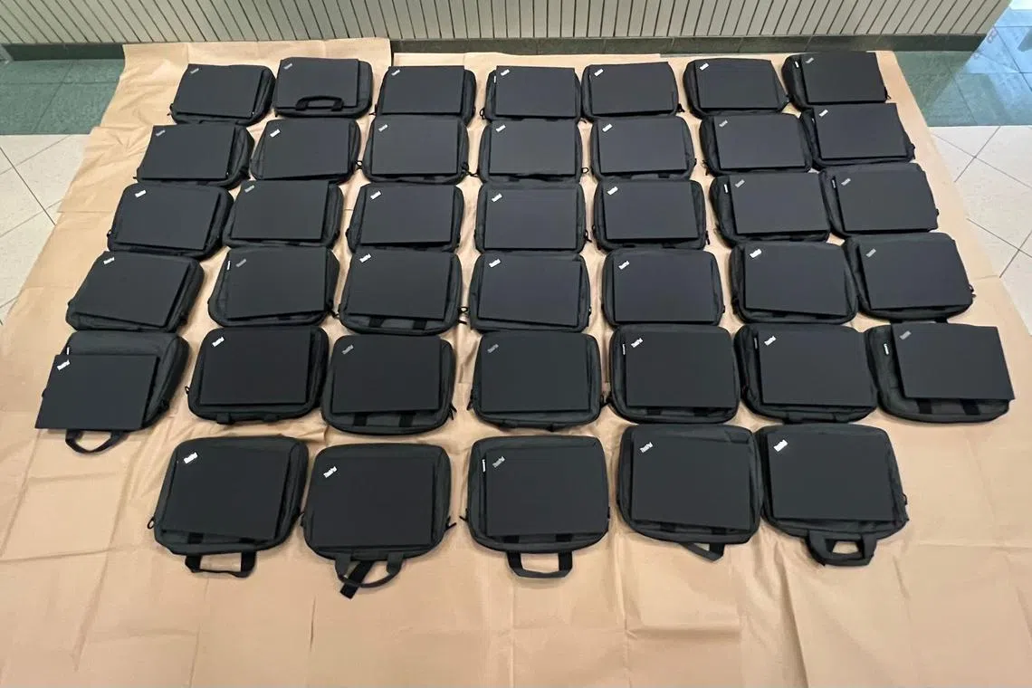 Upon their arrest, 40 laptops and $16,000 were recovered from the duo.