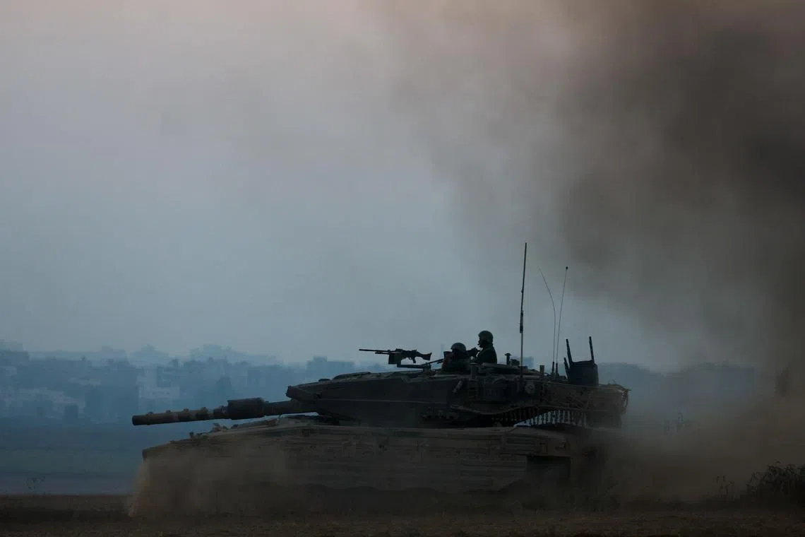An Israeli tank manoeuvres, amid the Israel-Hamas conflict, near the Israel-Gaza border, in Israel, July 9, 2024. REUTERS/Amir Cohen/ File Photo