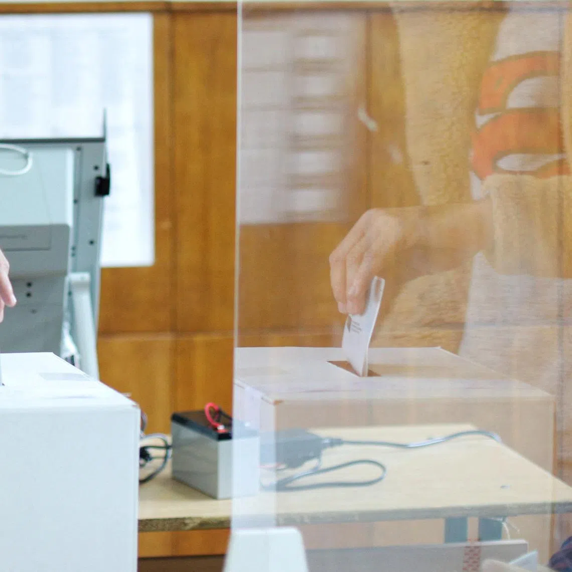 FILE PHOTO: A person casts vote at a polling station, during parliamentary and presidential elections, in Sofia, Bulgaria, November 14, 2021. REUTERS/Spasiyana Sergieva/File Photo