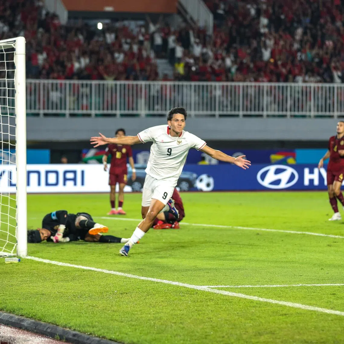 Indonesian national Football player Mitchell Lee Baker celebrates after successfully scoring a goal against the Cambodia national team in ASEAN Hyundai Cup 2026 match.