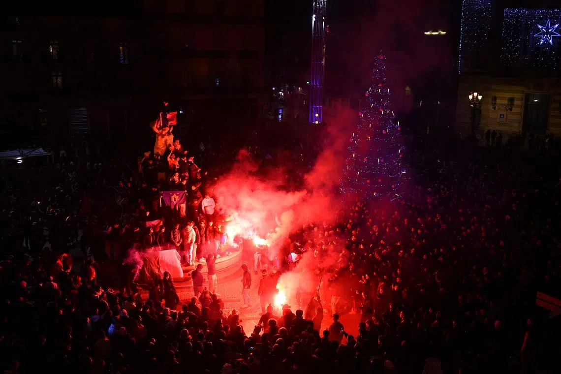 French supporters celebrate their team's victory over England in the Qatar 2022 World Cup in Montpellier.