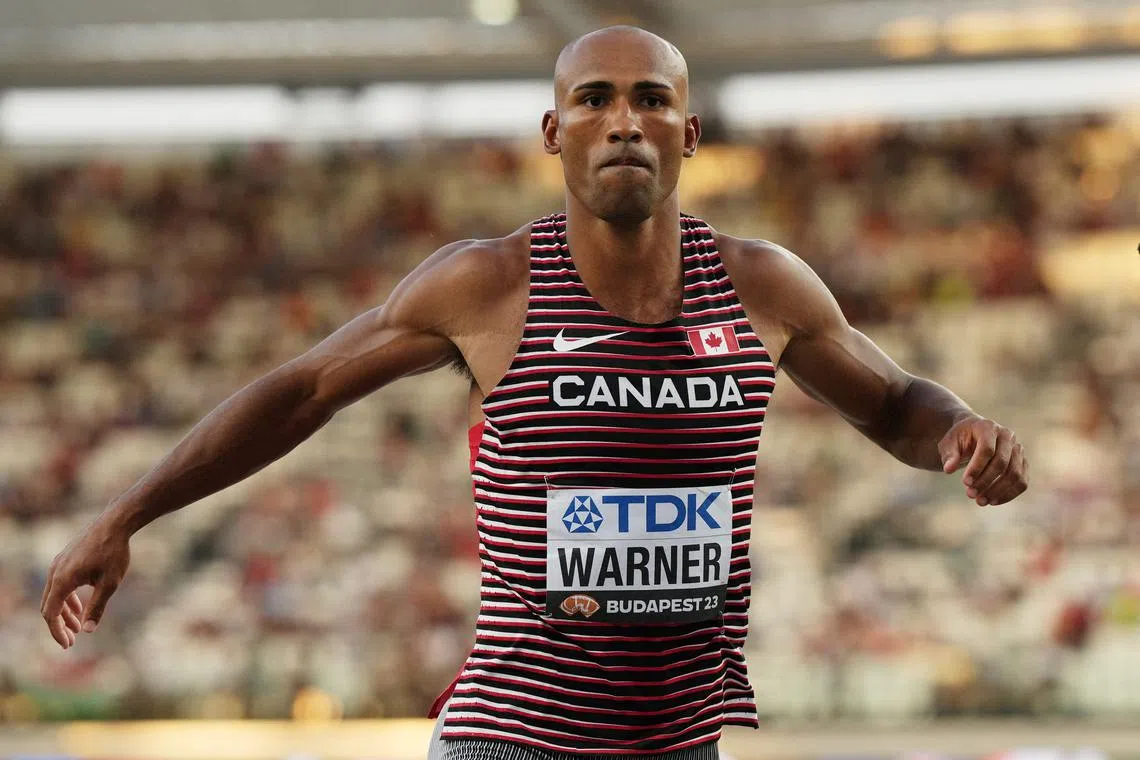 FILE PHOTO: Athletics - World Athletics Championship - Men's Decathlon - National Athletics Centre, Budapest, Hungary - August 25, 2023 Canada's Damian Warner reacts during the high jump REUTERS/Aleksandra Szmigiel/File Photo