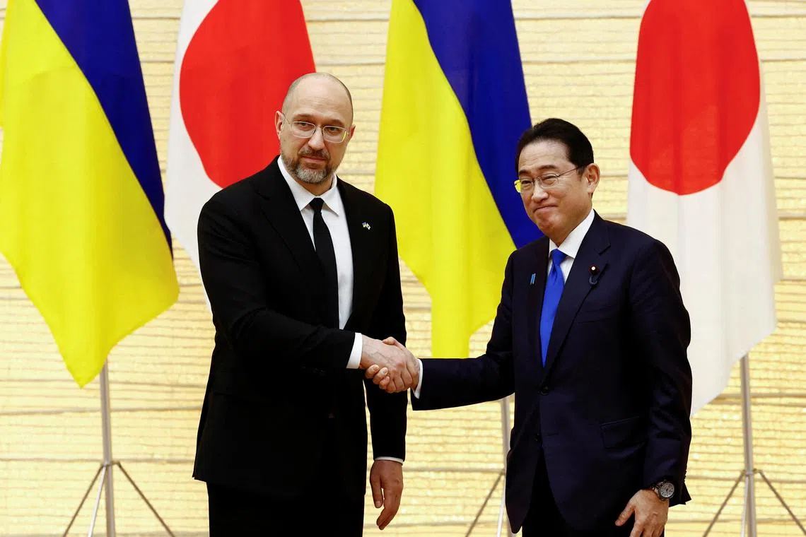 Ukraine's Prime Minister Denys Shmyhal shakes hands with Japanese Prime Minister Fumio Kishida after their joint press briefing as a part of the Japan-Ukraine Conference for Promotion of Economic Growth and Reconstruction at Kishida's official residence in Tokyo, Japan February 19, 2024.  REUTERS/Issei Kato/Pool