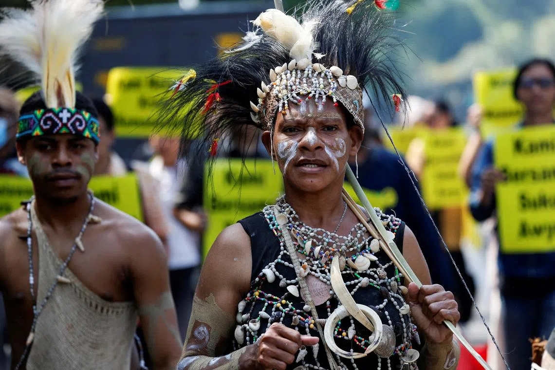 FILE PHOTO: Papuan activists take part in a protest against deforestation by palm oil companies on their indigenous land in Papua, outside the country's Supreme Court in Jakarta, Indonesia, May 27, 2024. REUTERS/Willy Kurniawan/File Photo