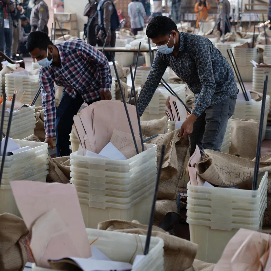 Officials giving a final check before dispatching the ballot boxes to voting centres, a day ahead of Bangladesh's general election, in Dhaka on Feb 11.