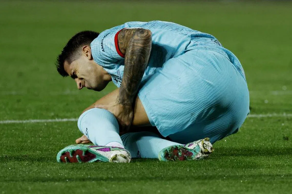 FILE PHOTO: Soccer Football - LaLiga - Las Palmas v FC Barcelona - Estadio Gran Canaria, Las Palmas, Spain - January 4, 2024 FC Barcelona's Joao Cancelo reacts after sustaining an injury REUTERS/Borja Suarez/File Photo
