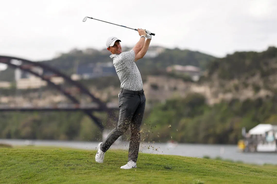Rory McIlroy of Northern Ireland plays his shot on the 14th hole at the WGC Match Play Championship.