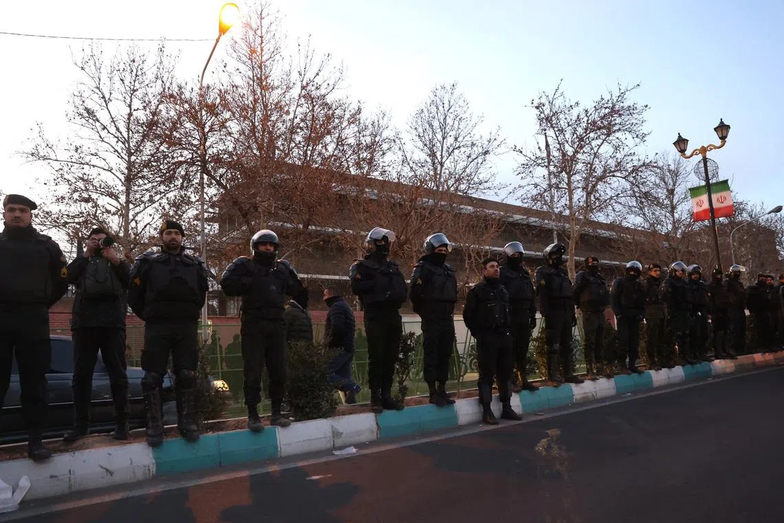 Members of the Iranian police stand guard at a protest in front of the British embassy following anti-government protests in Tehran, Iran, January 14, 2026. Majid Asgaripour/WANA (West Asia News Agency) via REUTERS