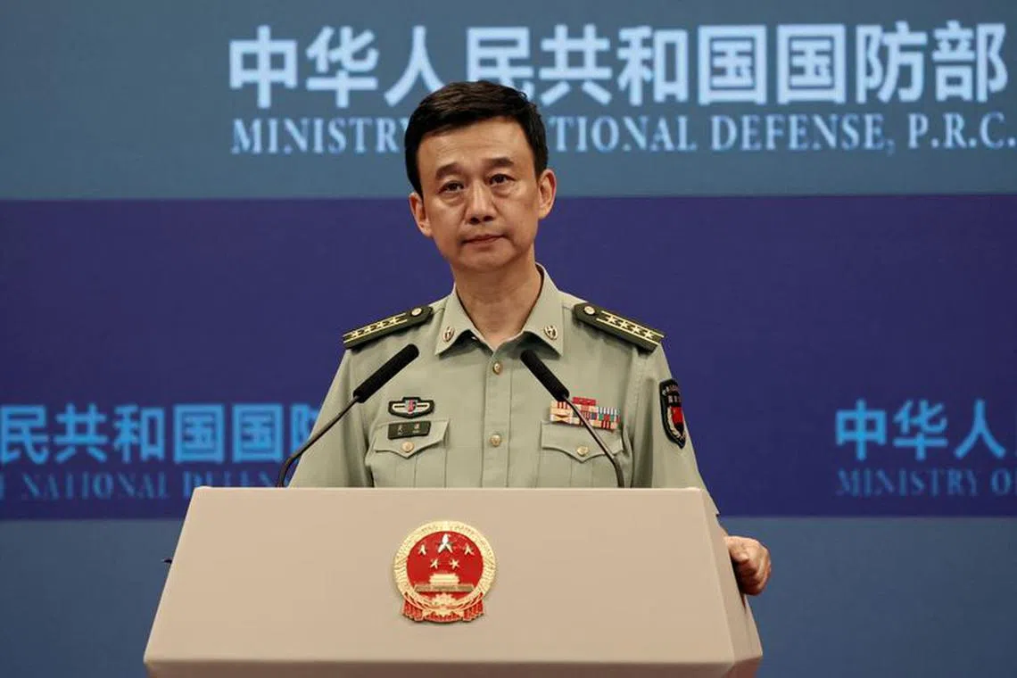 FILE PHOTO: Chinese Defence Ministry spokesperson Wu Qian attends a press briefing in Beijing, China August 31, 2023. REUTERS/Shubing Wang