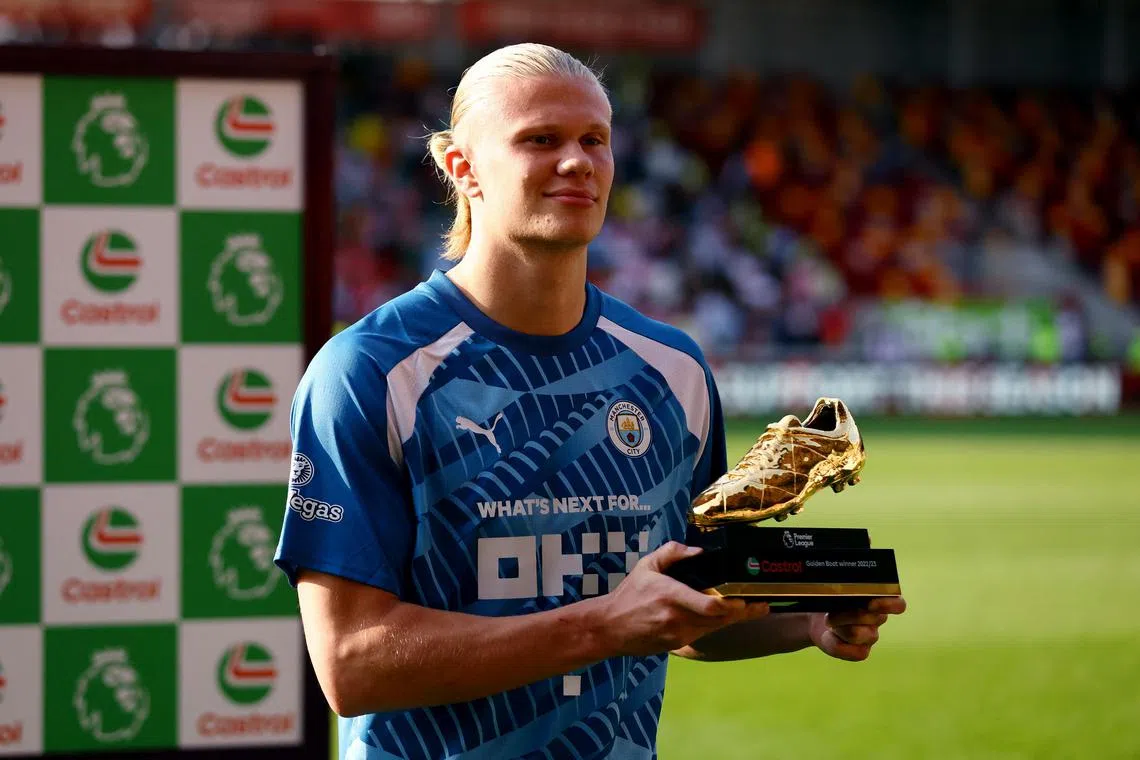 Manchester City's Erling Braut Haaland with the golden boot after the match against Brentford.