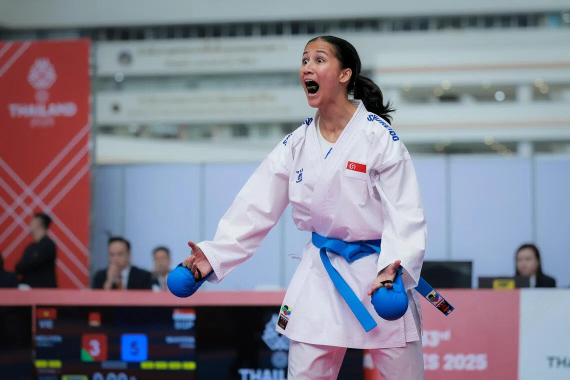 Singapore’s Marissa Hafezan celebrates after defeating Vietnam’s Nguyen Thi Dieu Ly in the karate women’s kumite 55kg final at the Chaeng Watthana Government Complex in Bangkok. The 19-year-old’s 5-3 victory secures Singapore’s first SEA Games karate gold since 1993.
