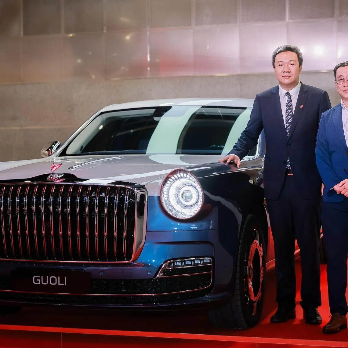 China FAW Group Import & Export Assistant General Manager Liu Jifang (taller) and Eurokars Group COO Collin Teo (shorter) with the Hongqi Guoli at the Singapore Motorshow at Suntec Convention & Exhibition Centre on Jan 8, 2026.