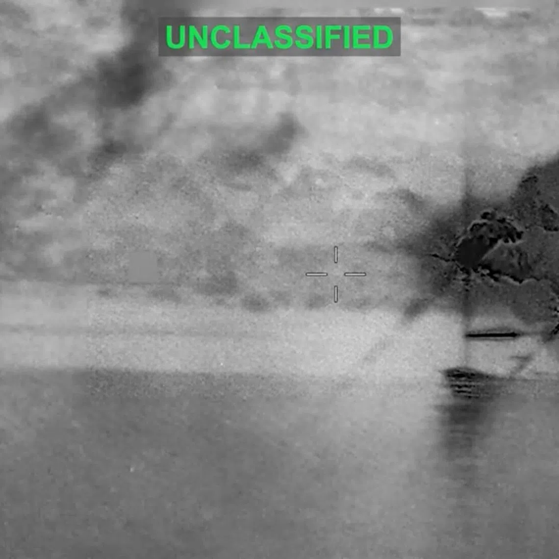 Smoke rises at an unknown location following what the U.S. Central Command says is a new wave of strikes against Iran on Tuesday after three tankers were hit by projectiles in the Strait of Hormuz, in this still image taken from video released July 7, 2026.    U.S. Central Command/Handout via REUTERS