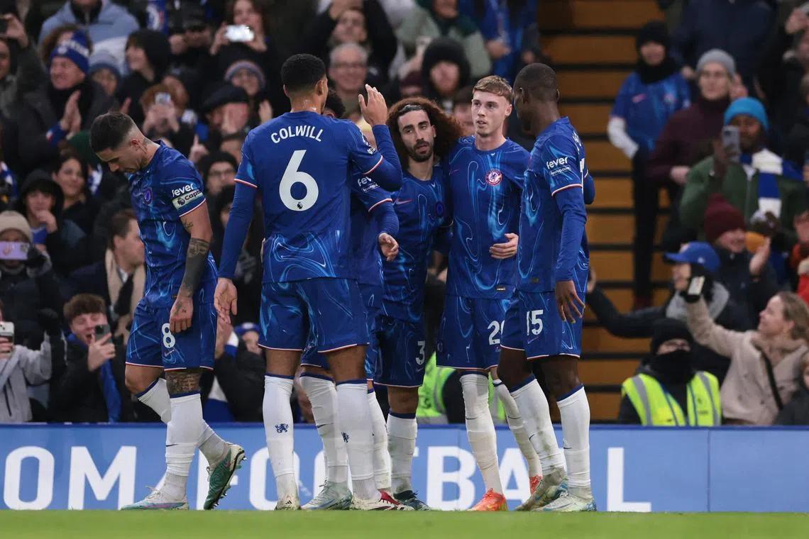 FILE PHOTO: Soccer Football - Premier League - Chelsea v Fulham - Stamford Bridge, London, Britain - December 26, 2024 Chelsea's Cole Palmer celebrates scoring their first goal with teammates REUTERS/Hannah Mckay/File Photo