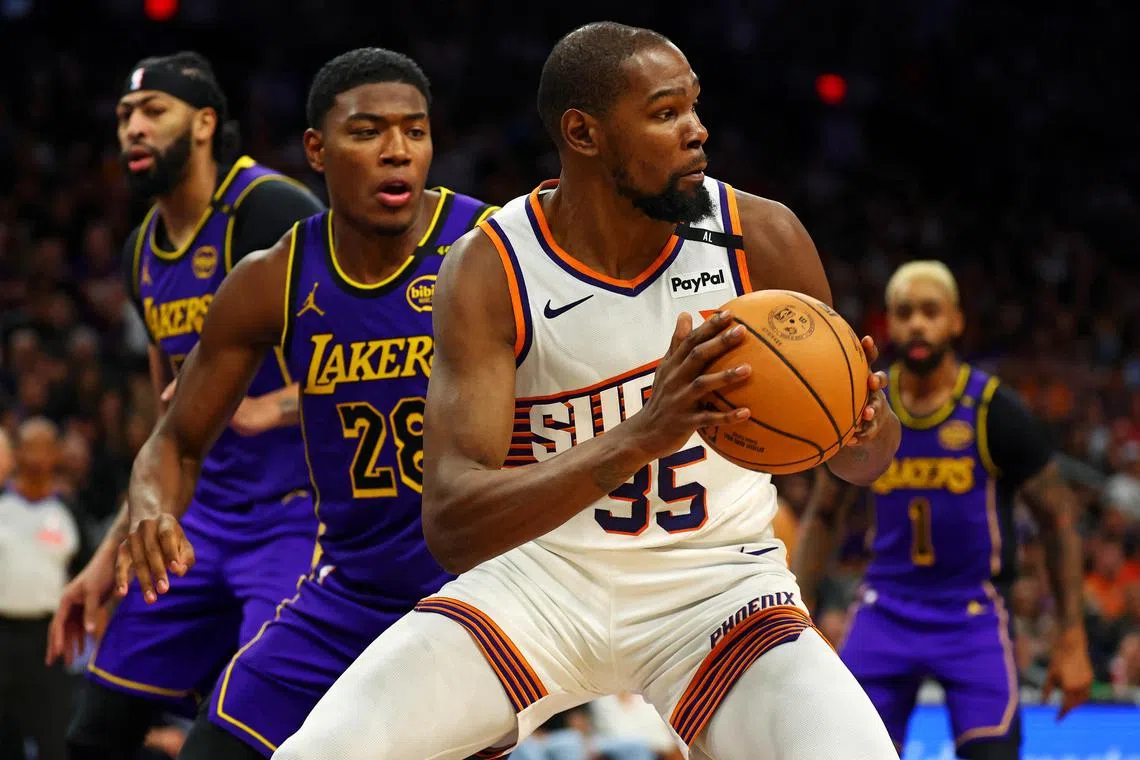 Phoenix Suns forward Kevin Durant handles the ball against Los Angeles Lakers forward Rui Hachimura during the second half at Footprint Centre.